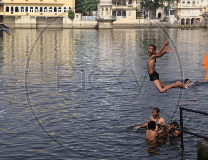 Kids Jumping into the Lake for Swimming, Udaipur