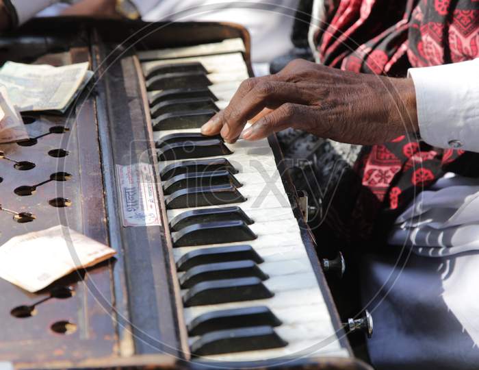 Rajasthani Man Playing Piano in Shilpgram Fair, Udaipur, Rajasthan