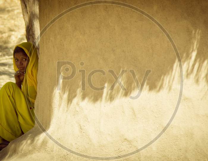 Portrait of Young Rajasthani Woman outside her House