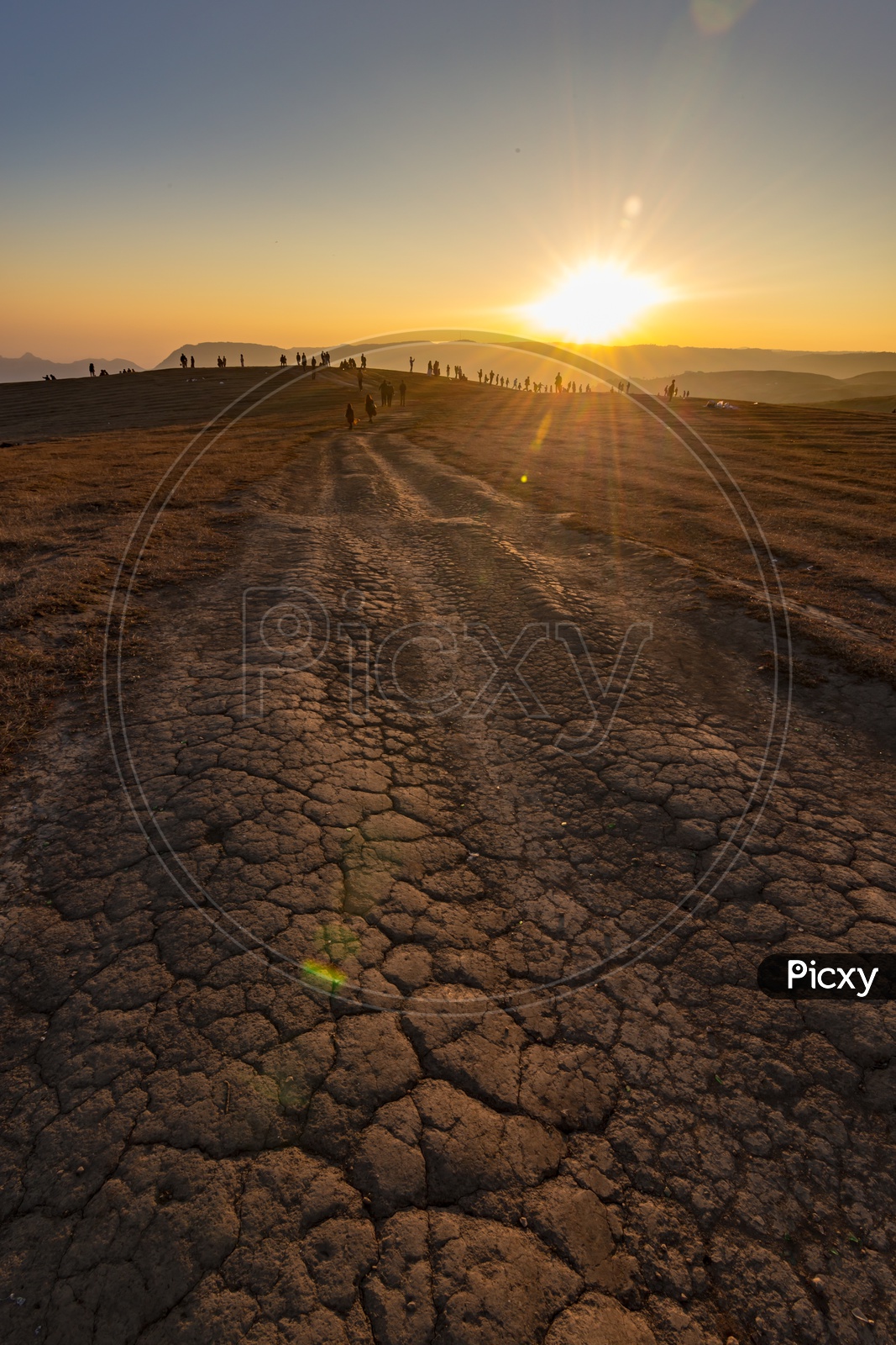 Dried Cracked Land With Cracks on an Terrain Land With A Sunset View Point in Meghalaya