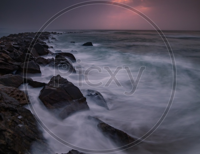 Long Exposure Shot Of Bay Of Bengal Sea With Sunset Blue Hour Sky Composition At Vizag Beach