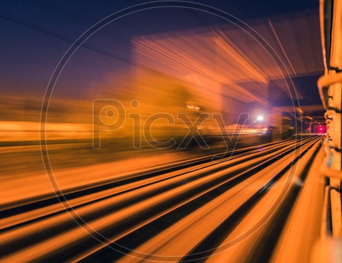 Long Exposure Of Railway Track Lines And Station From a Moving  Train Window