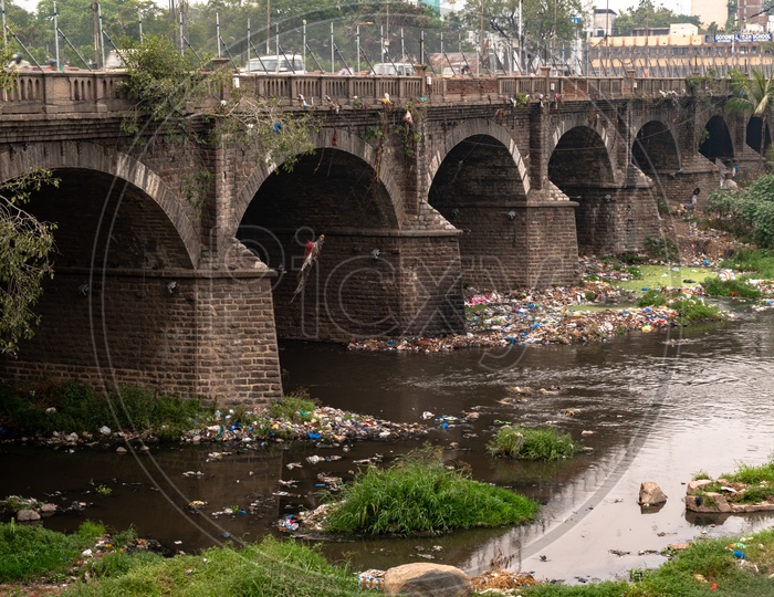 Garbage blocking the flow of musi river at high court of Telangana.