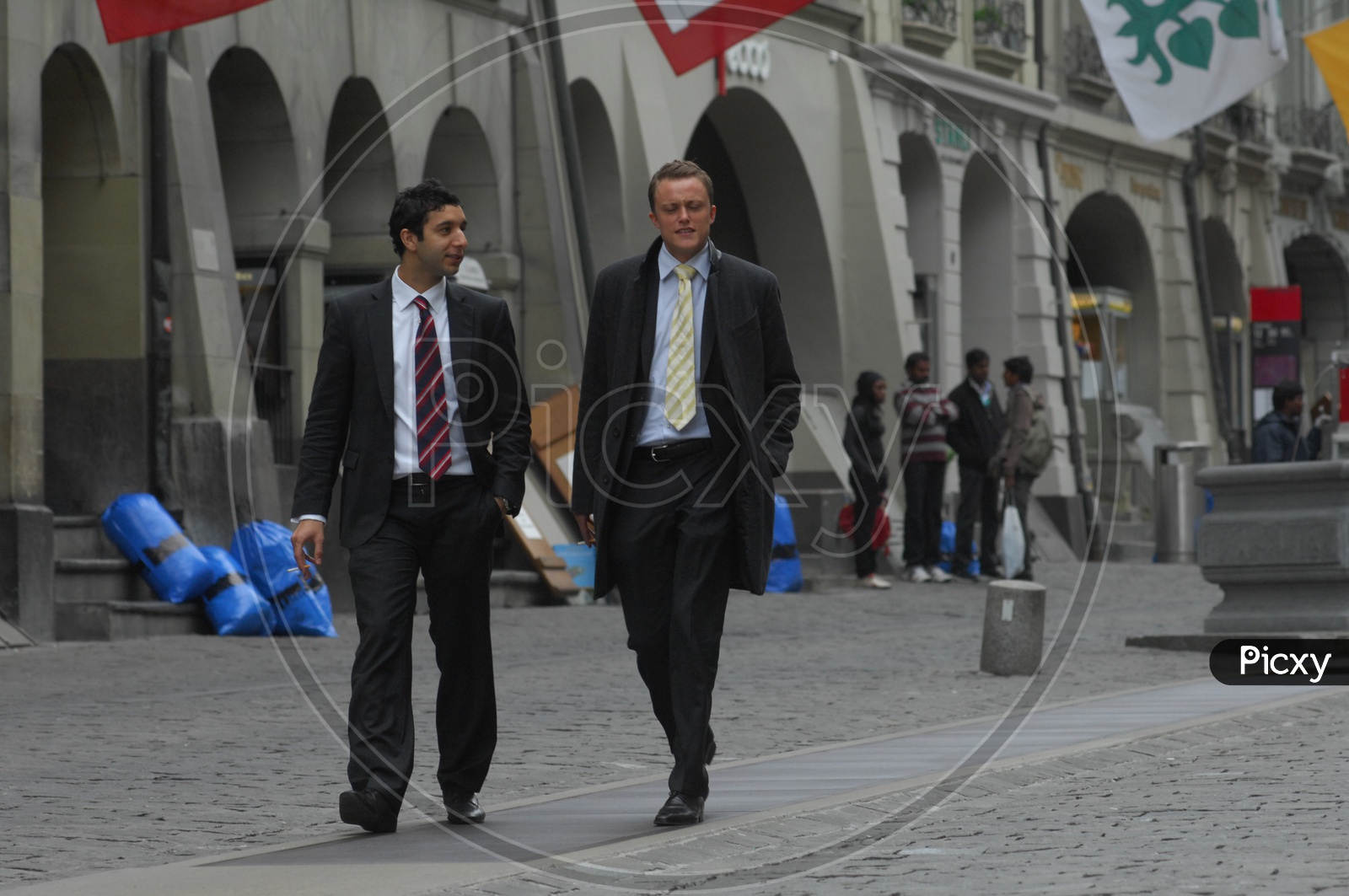 Swiss Men wearing suits walking on the streets
