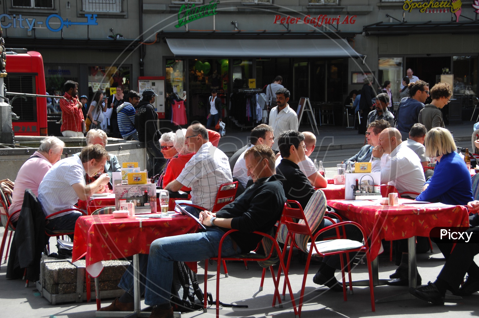 People Sitting on Dining Tables At a Food court in Switzerland