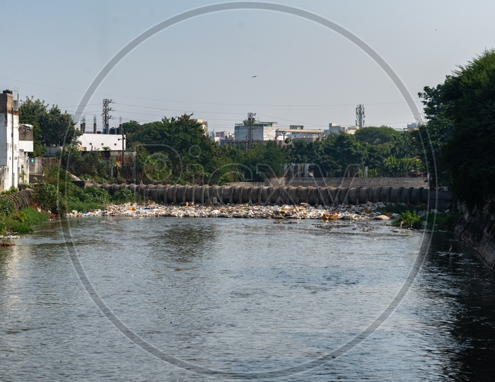 Garbage blocking the flow of musi river.