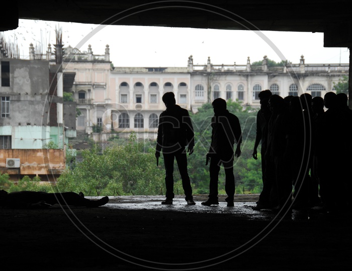 Silhouette Of People  In an Under Construction Building