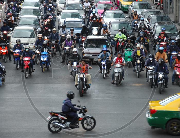 Vehicles Moving From a Traffic  Signal in Bangkok