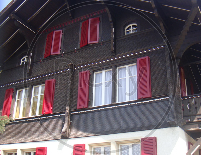 Colorful windows of a wooden house in Switzerland
