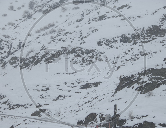Film Crew Shooting In Snow filled MountainsIn Switzerland