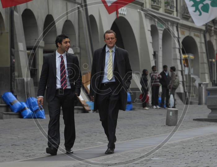 Swiss Men wearing suits walking on the streets