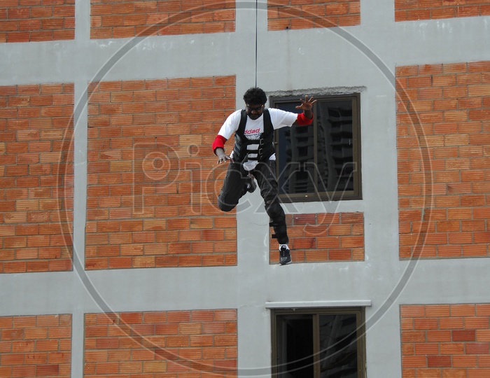 Man Jumping From a Building In Movie Working Stills