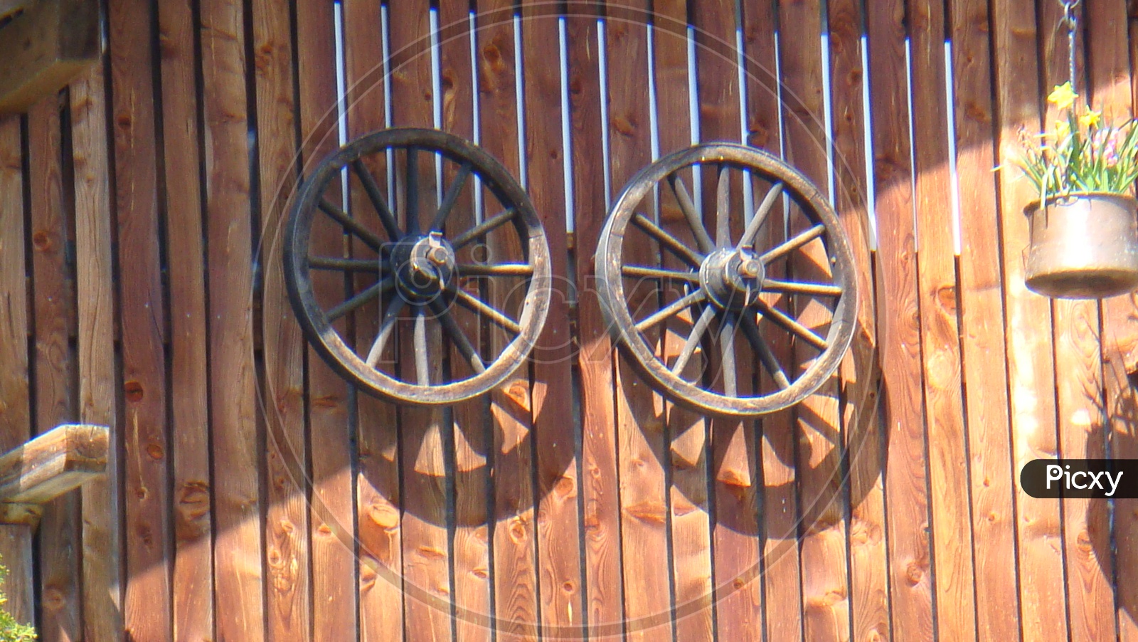 Wooden wagon wheels on the wall