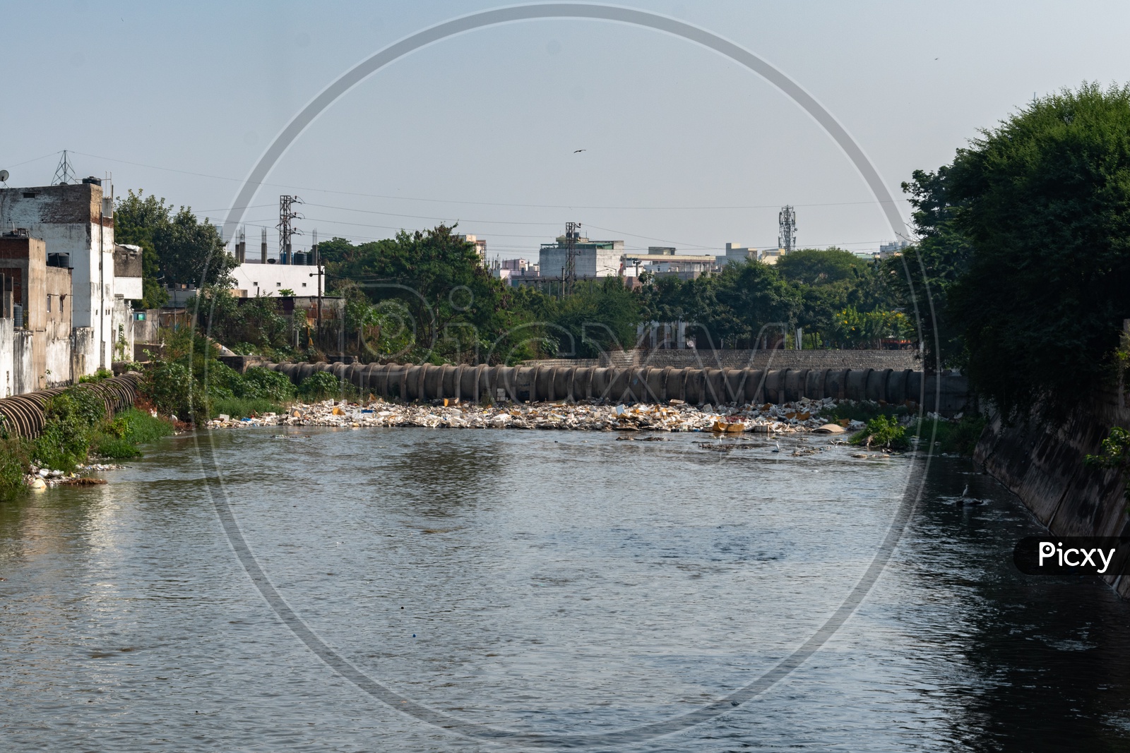 Garbage blocking the flow of musi river.