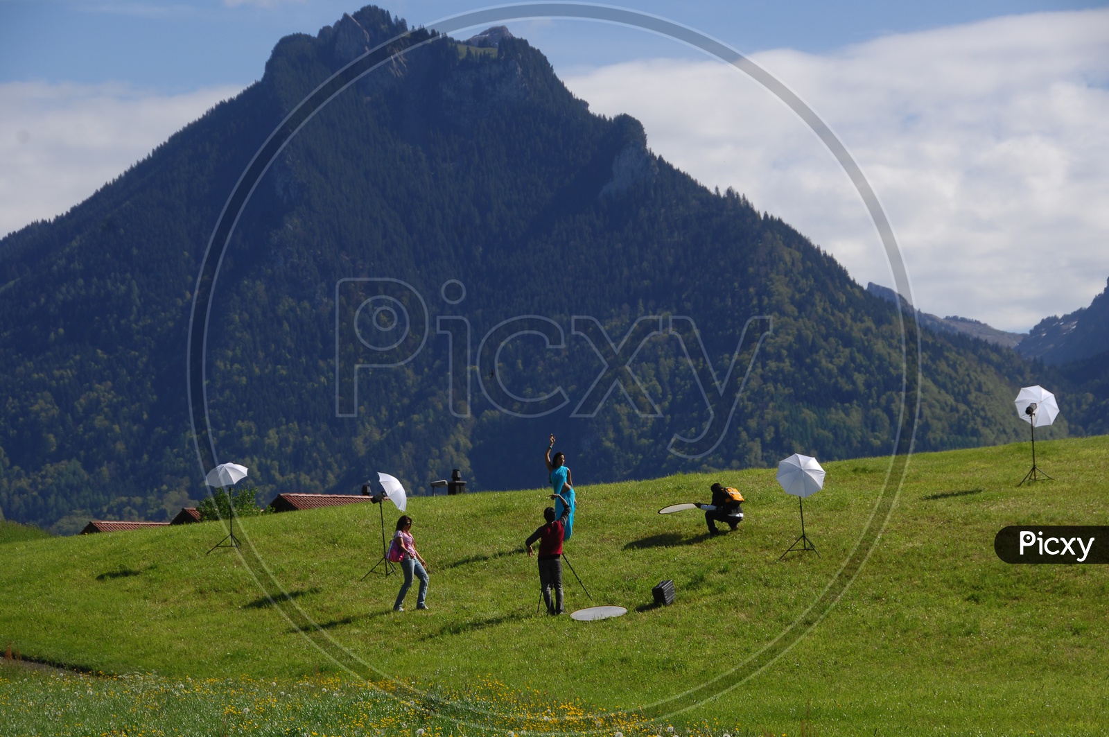 Photo Shoot In Swiss Alps With Mountains in Background In Movie Working Stills
