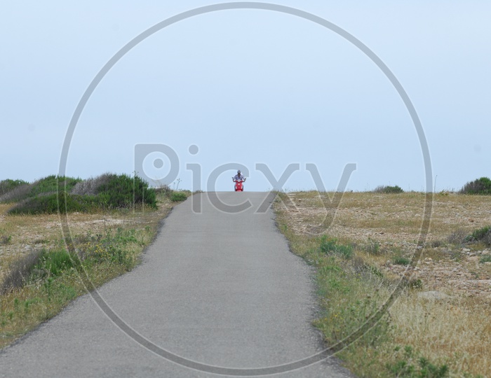 Couple Enjoying Bike Ride on an Lone Road