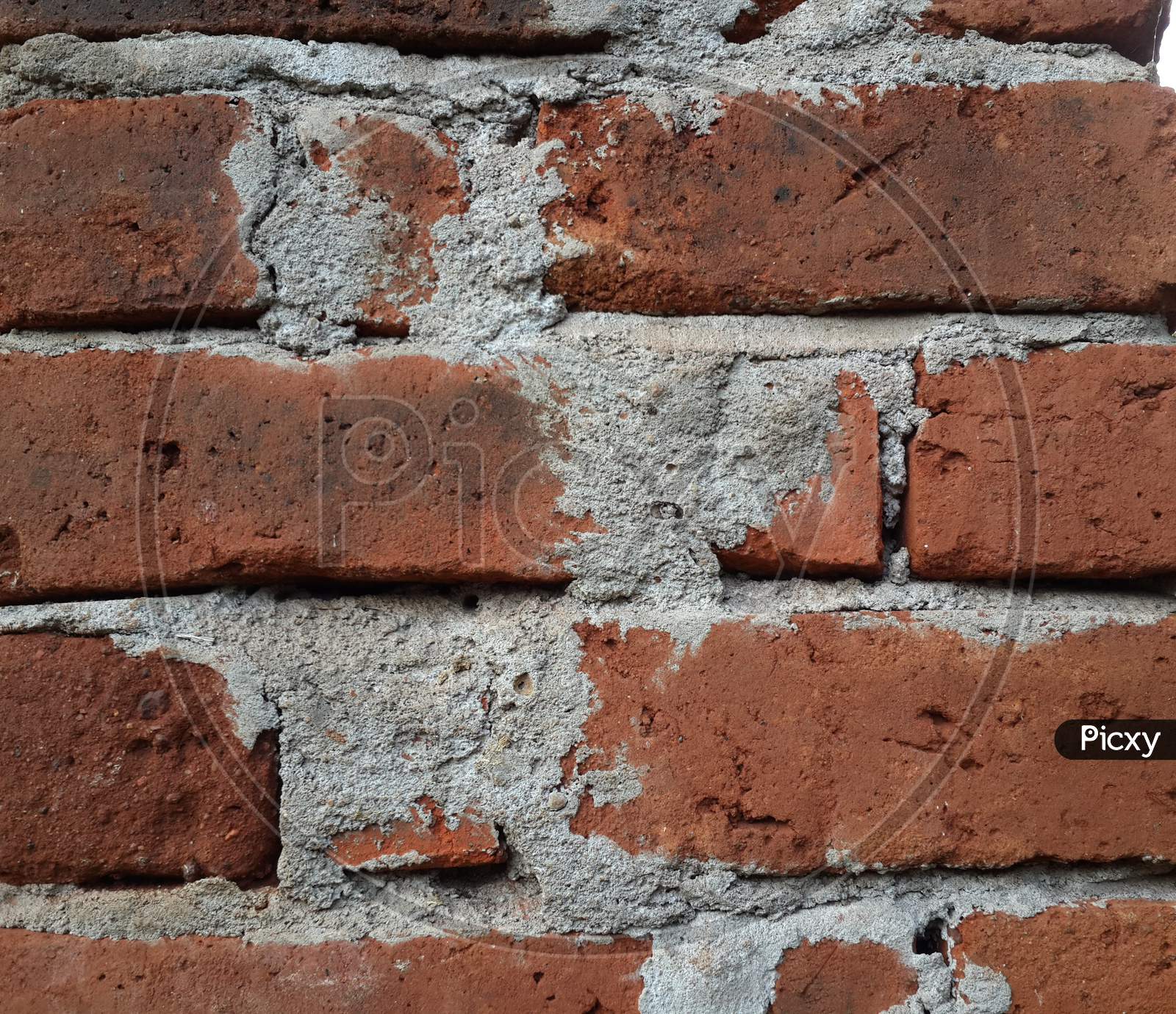 red brick wall of cement pattern closeup