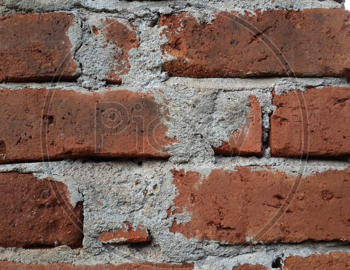 red brick wall of cement pattern closeup
