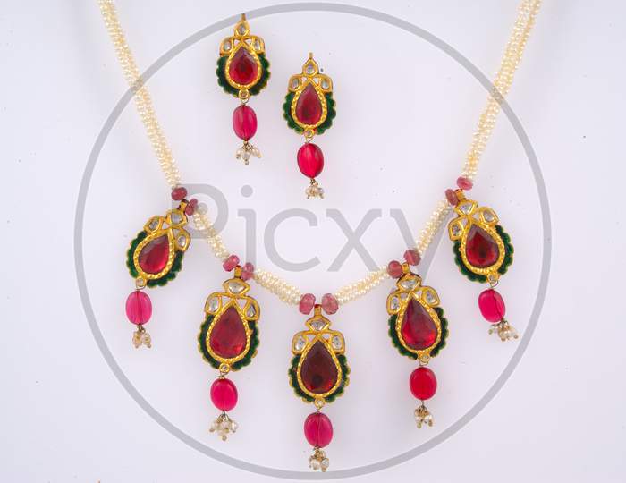 Diamond Necklace And Ear Rings  With Gemstones On a Isolated White Background