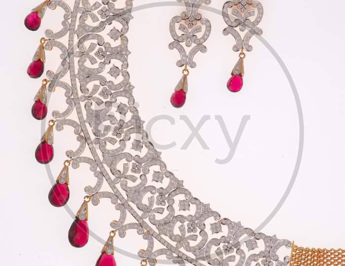 Diamond Necklace Jewelery With Ear Rings Over an Isolated White Background