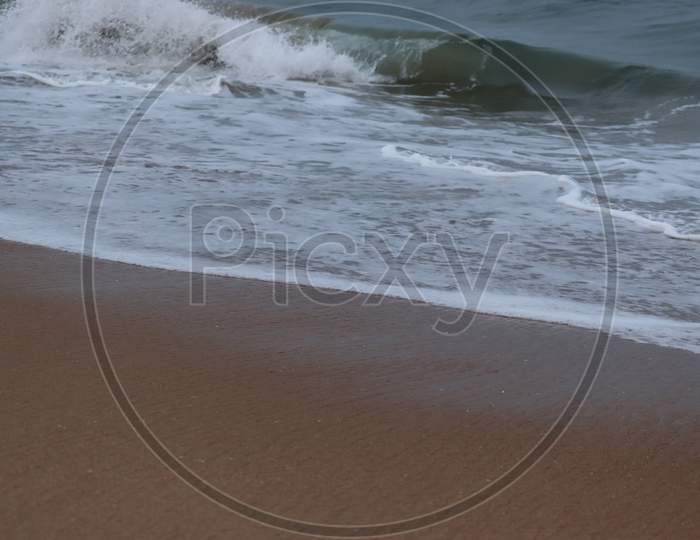 Beautiful Sand Beach.Close Up Soft Wave Lapped The Sandy Beach, Summer Background.