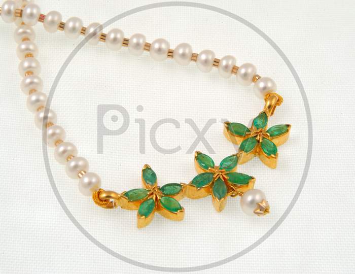 Diamond Necklace Jewelery  With White Pearls  Over an Isolated White Background