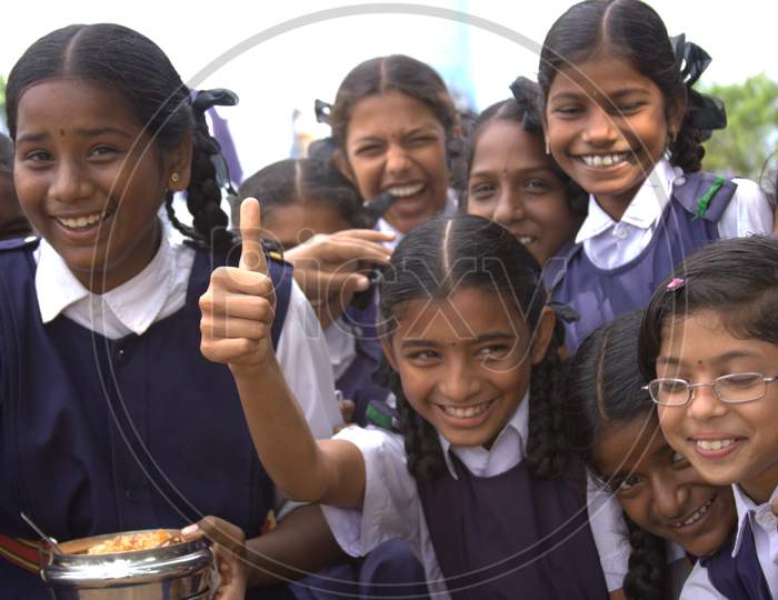 Group Of School Girls Smiling And With Thumb Up Gesture