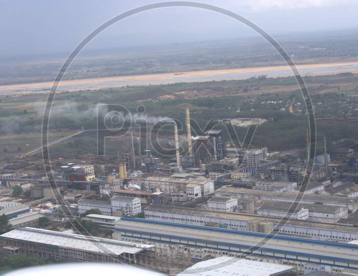 Aerial View Of an Industrial Plant With Exhaust Pipes And Smoke