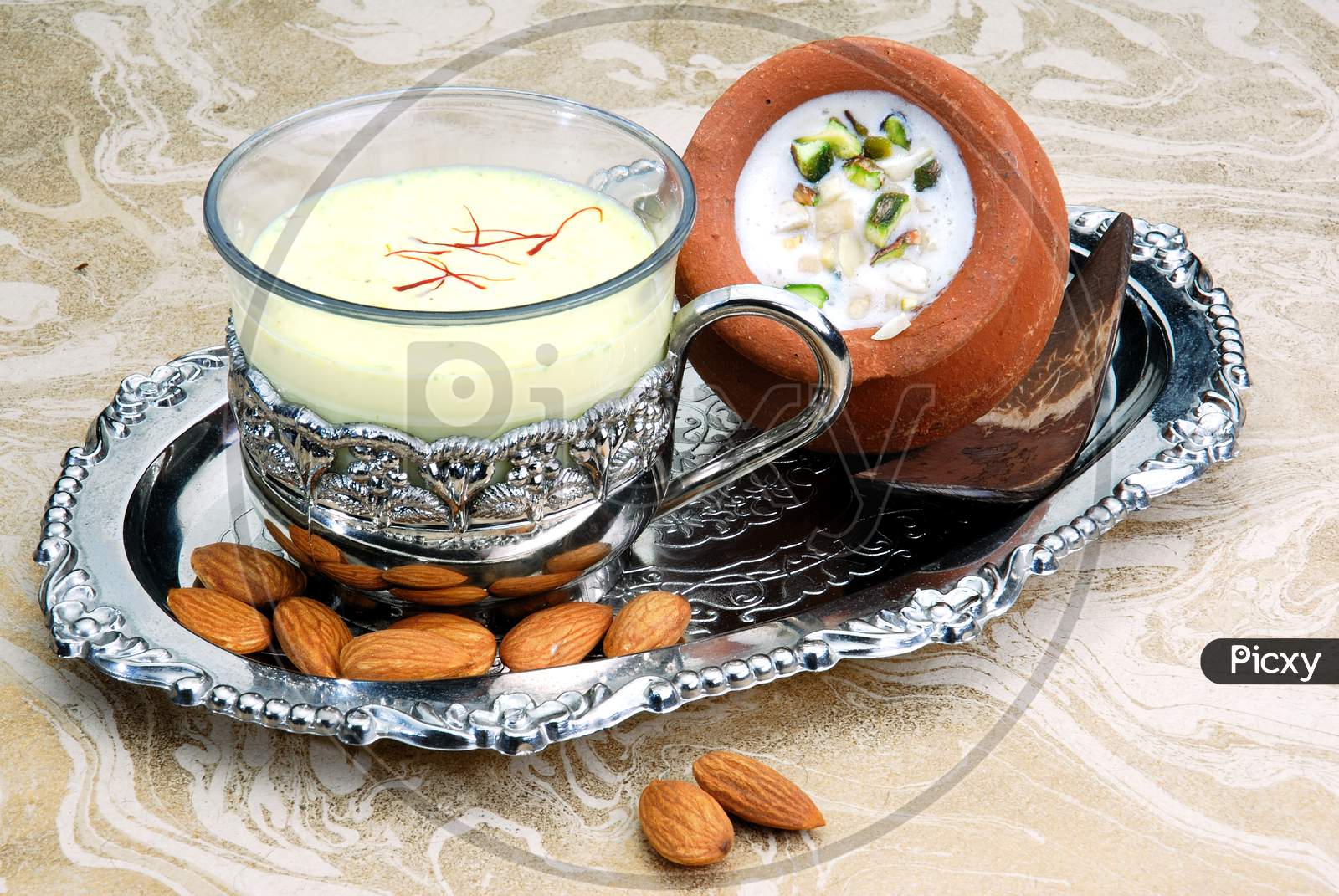Indian Sweet Dessert or Sweet Condensed Milk With Saffron And Nuts