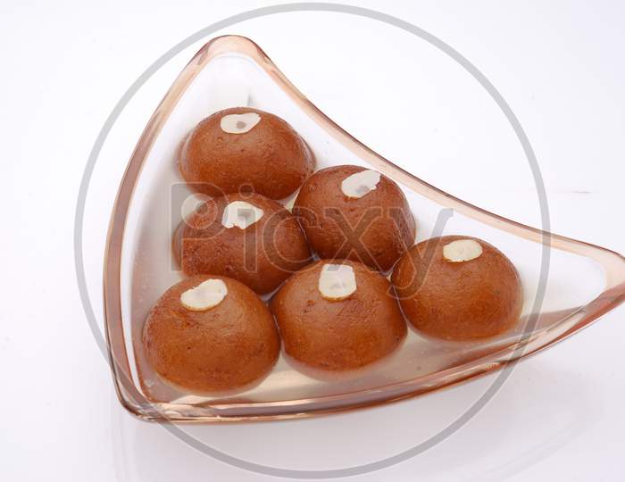 Gulab Jamun ,An Indian Sweet Savory Served in a Bowl on an isolated White Background