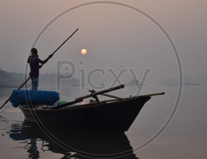 FisherFisherman  return home during sunset in Guwahatiman  return home during sunset in Guwahati