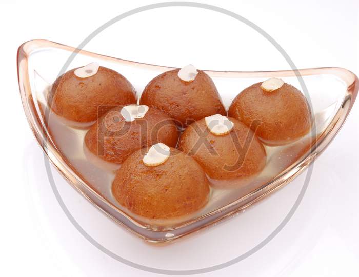 Gulab Jamun ,An Indian Sweet Savory Served in a Bowl on an isolated White Background