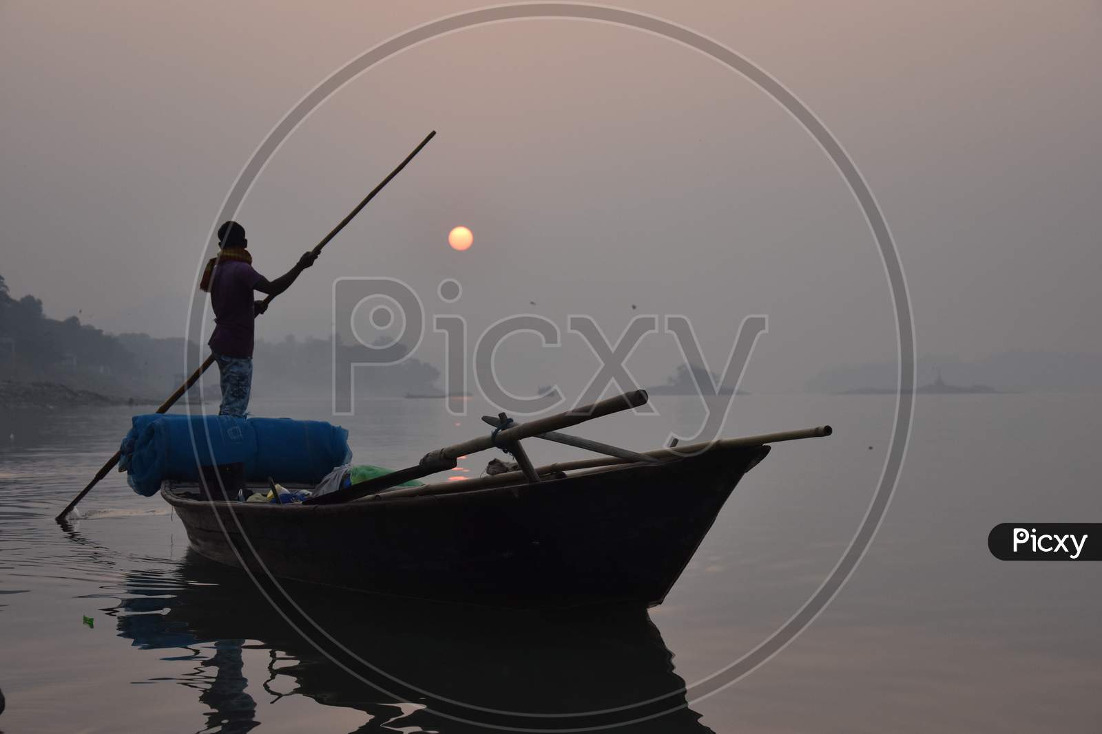 FisherFisherman  return home during sunset in Guwahatiman  return home during sunset in Guwahati
