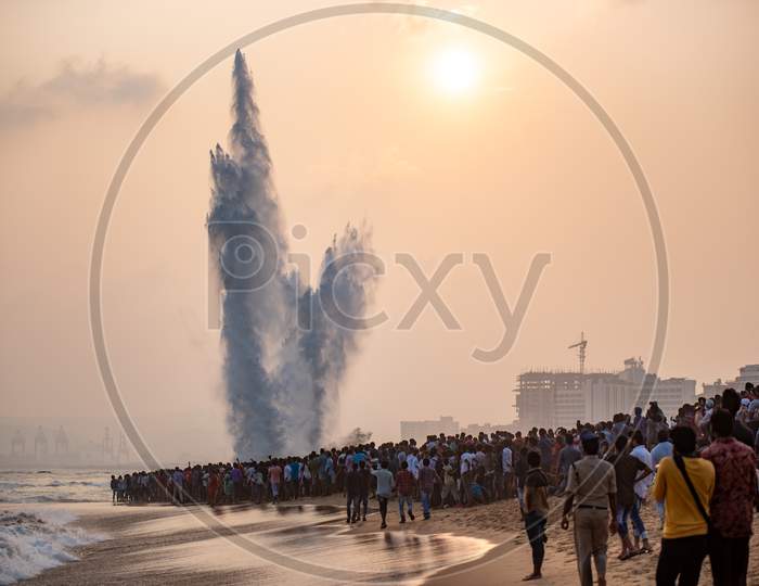 People watch an Explosion of a Dummy target by Indian Navy personnel on Navy Day in Visakhapatnam, Dec 4,2019