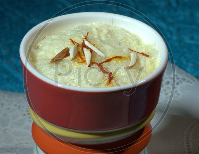 Indian Sweet Savory Condensed Milk With Saffron And Almonds Topping