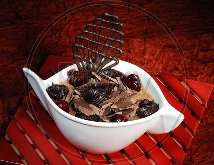 Indian Sweet Savory Kheer With Chocolate Ship Topping Served in a Bowl