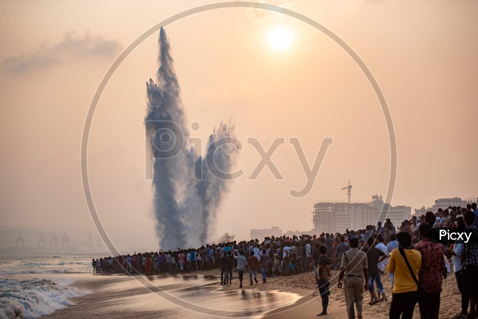 People watch an Explosion of a Dummy target by Indian Navy personnel on Navy Day in Visakhapatnam, Dec 4,2019