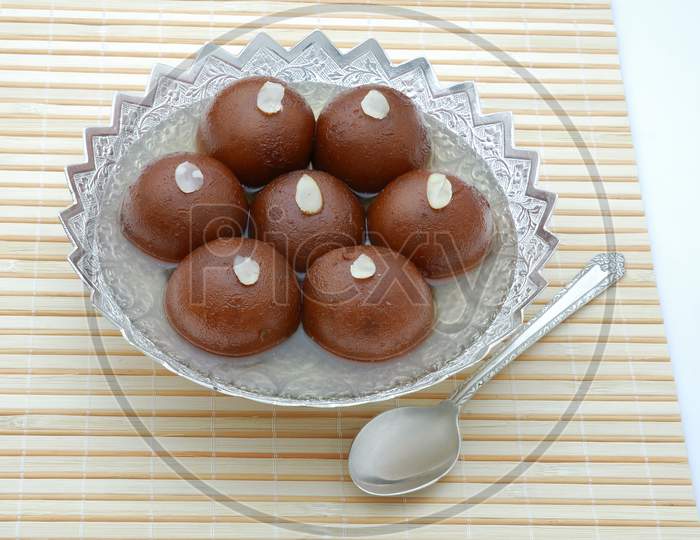 Gulab Jamun ,An Indian Sweet Savory Served in a Bowl Background