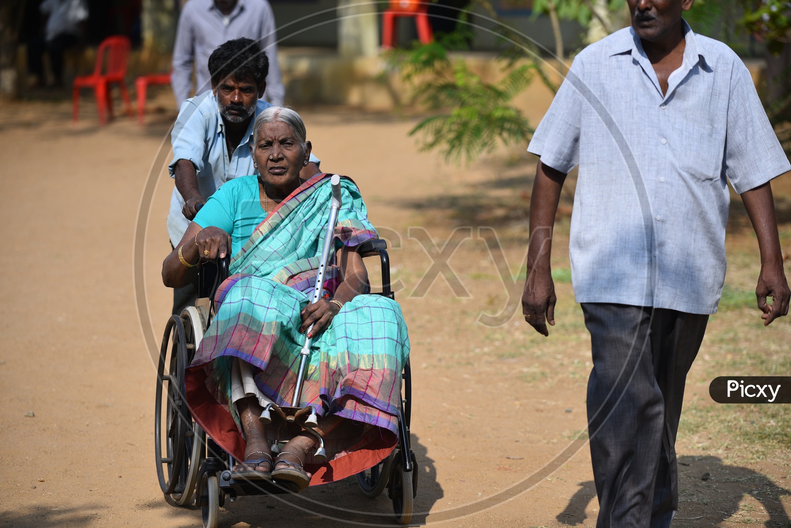 Photograph of old women on wheel chair