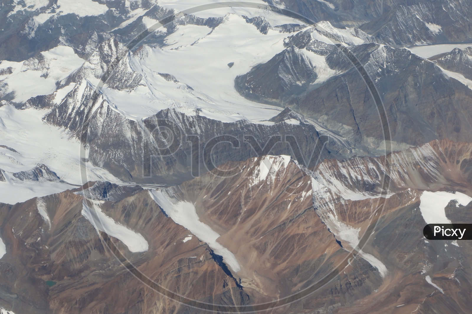 Beautiful Landscape of Snow Capped Mountains of Leh from flight window
