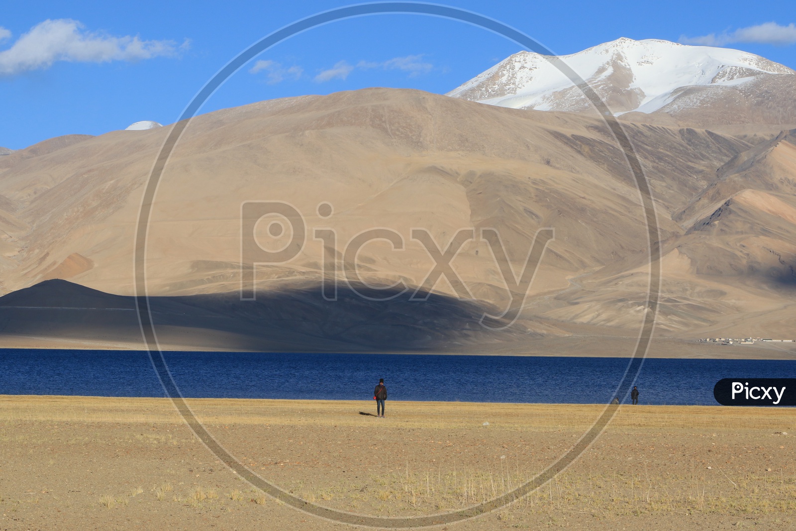 A Tourist at A River Valley With Sand Dunes and Blue Sky in Leh