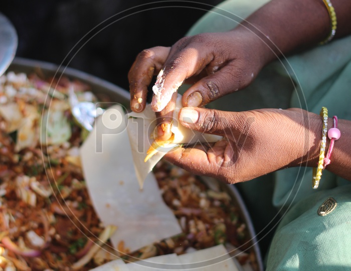 A Woman Preparing The Indian Street Food Samosa