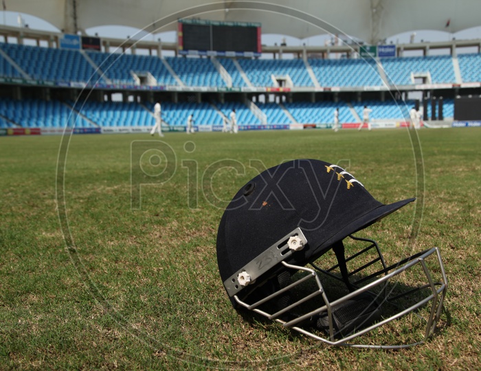 A Cricket helmet In a Ground