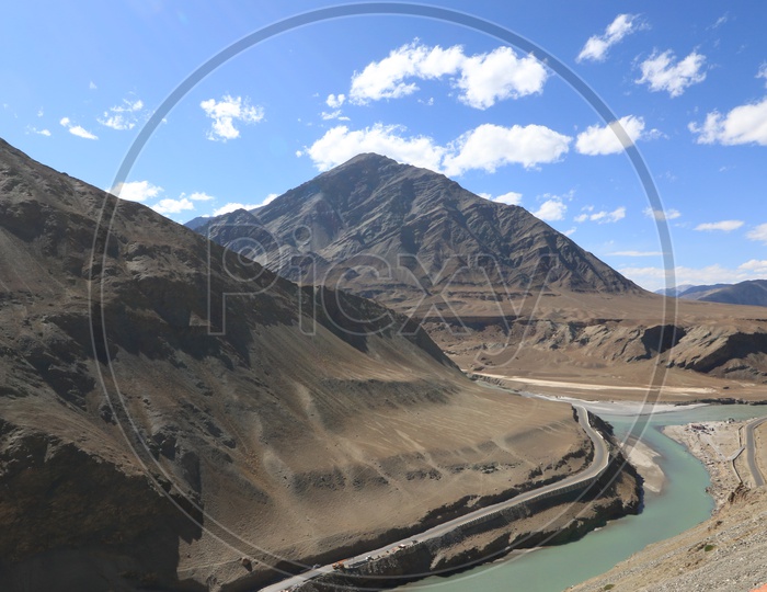 Mountains of leh with water flow in the foreground