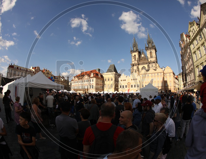 People gathered at an ancient building in Prague