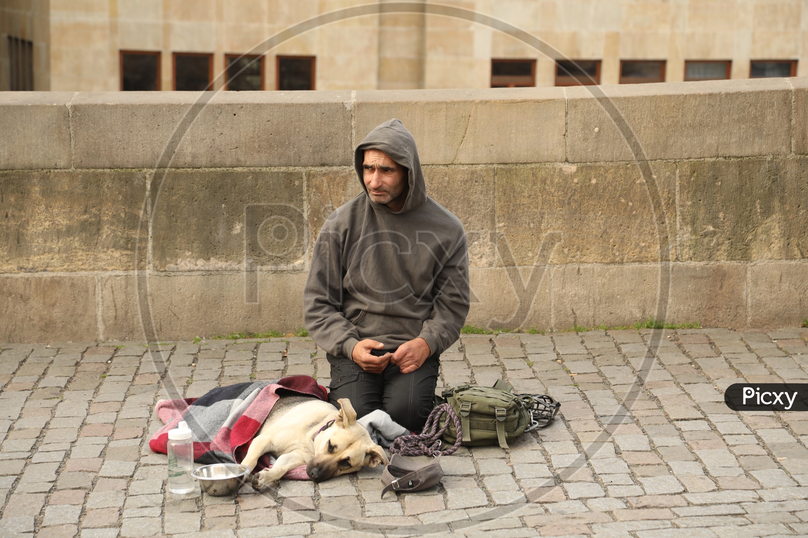 A Stray Man With his Dog On the Streets