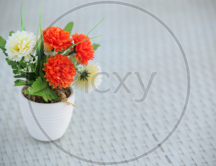 Artificial flowers in a pot