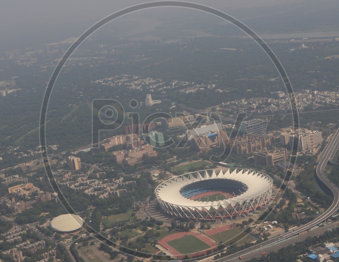 Delhi city in aerial view captured from flight window / Stadium in Delhi