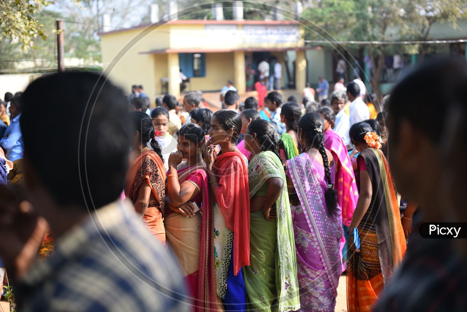 People Voters standing in queue to Cast their vote