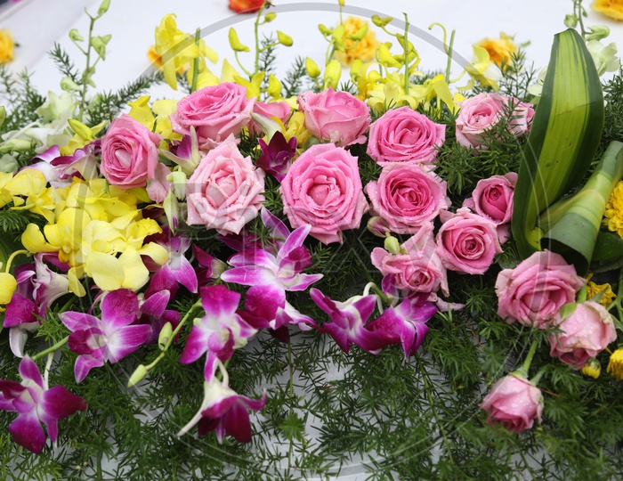 Decor with Pink Roses, Orchids & Yellow flowers
